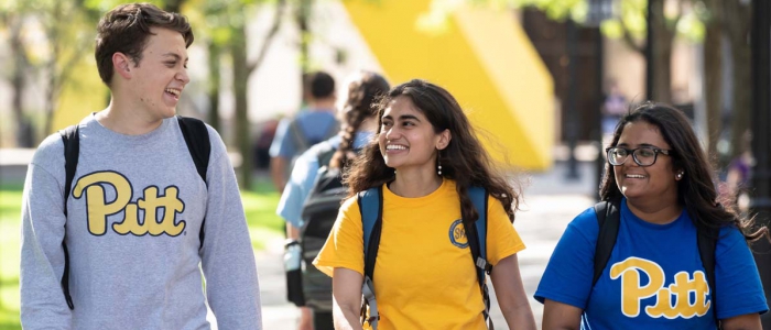 Pitt students walk together through campus 